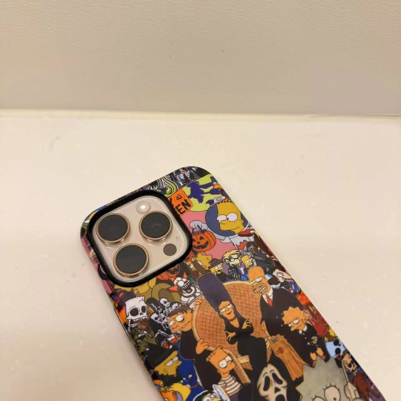 This unique Halloween phone case creatively combines The Simpsons and Ghostface, presenting a quirky vibe that makes your phone truly stand out.